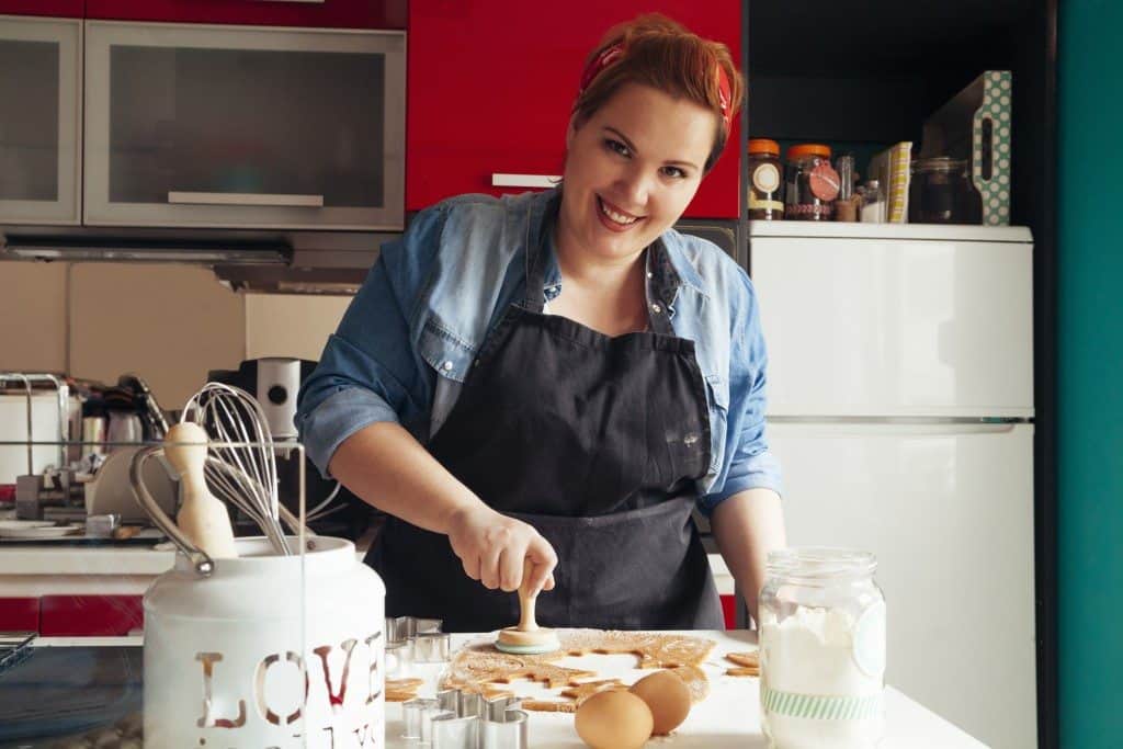Woman Making Cookies In The Kitchen